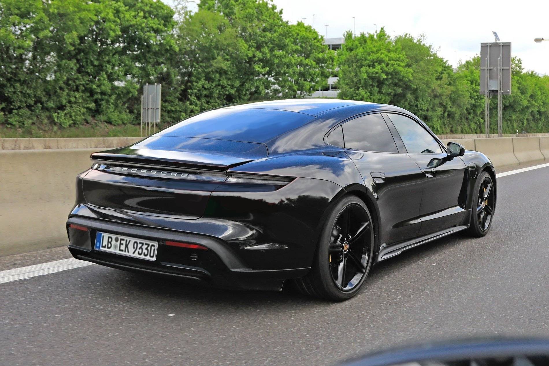 Porsche Taycan Taycan drops camo revealing headlights, tail lights, rear side window Side1
