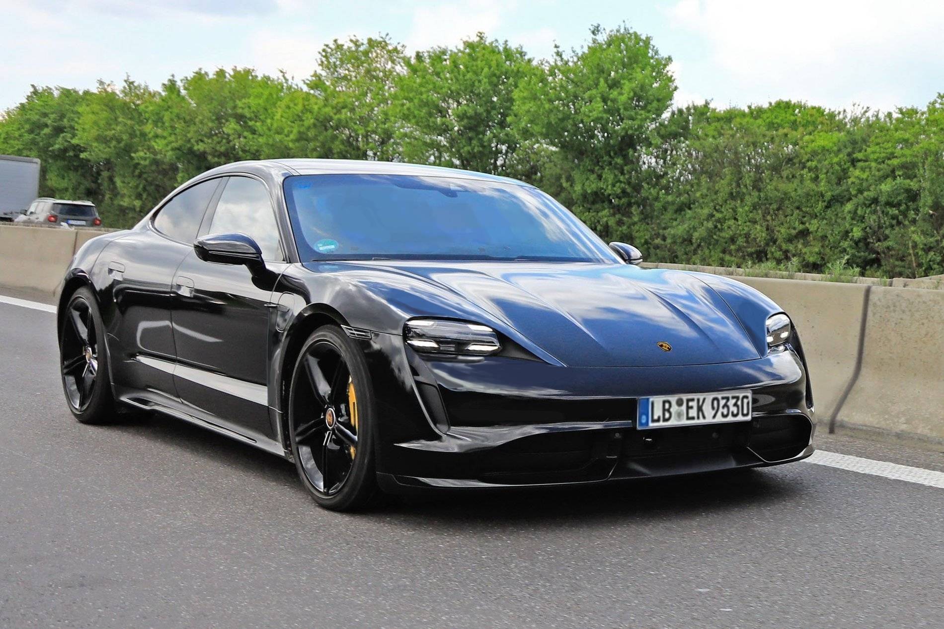 Porsche Taycan Taycan drops camo revealing headlights, tail lights, rear side window Sidefront1