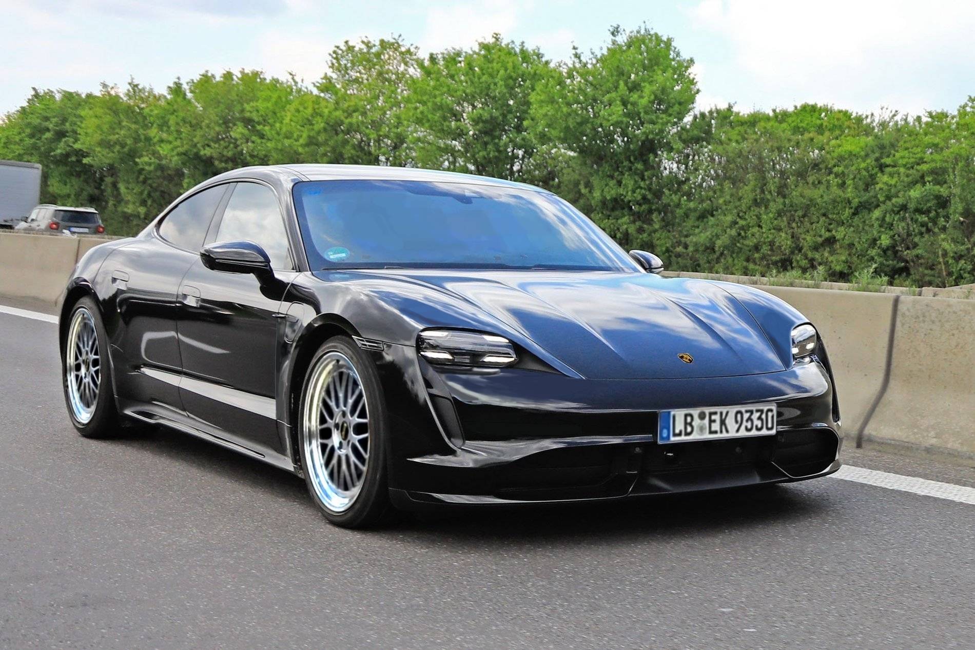Porsche Taycan Taycan drops camo revealing headlights, tail lights, rear side window Sidefront2