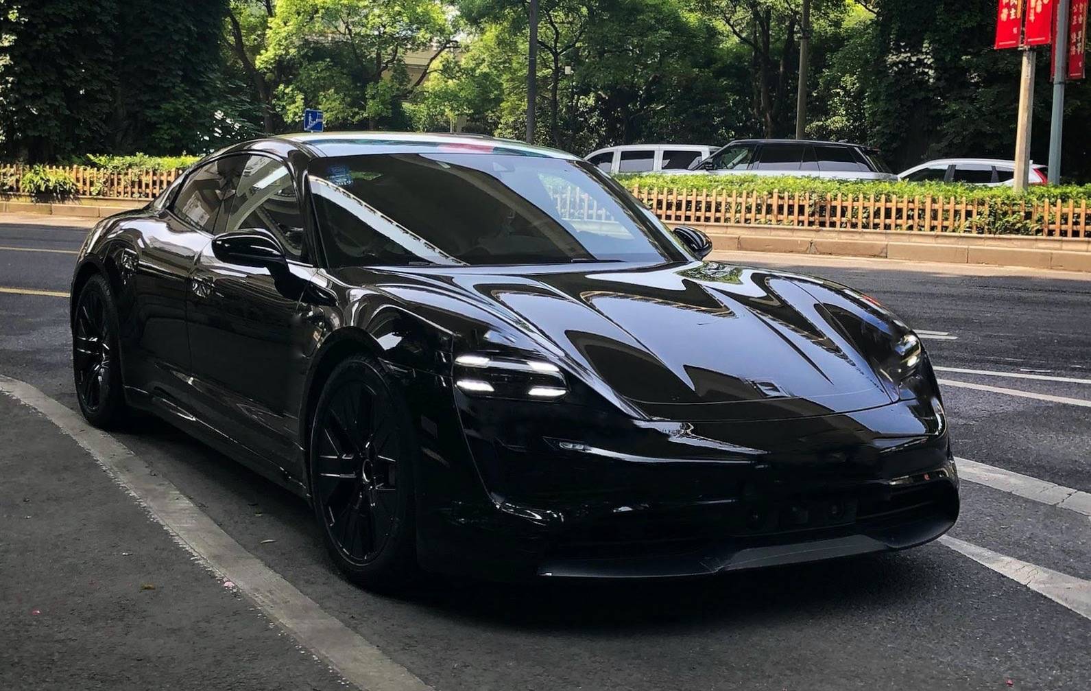 Porsche Taycan Taycan drops camo revealing headlights, tail lights, rear side window UNNAMED