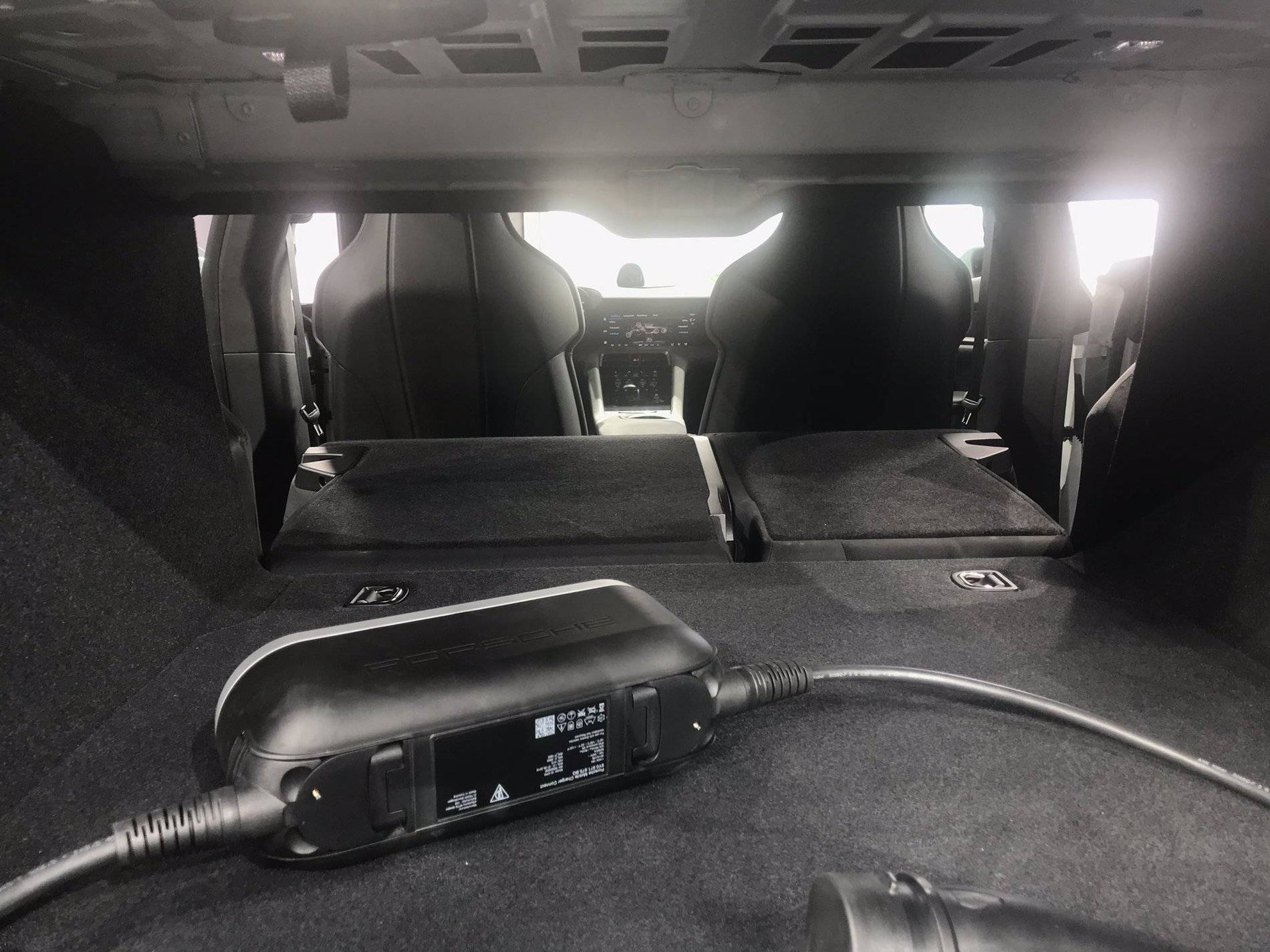 Porsche Taycan Porsche Taycan World Reveal. Watch Live Feed and React Here Porsche Taycan Rear Seats Folded Down 3