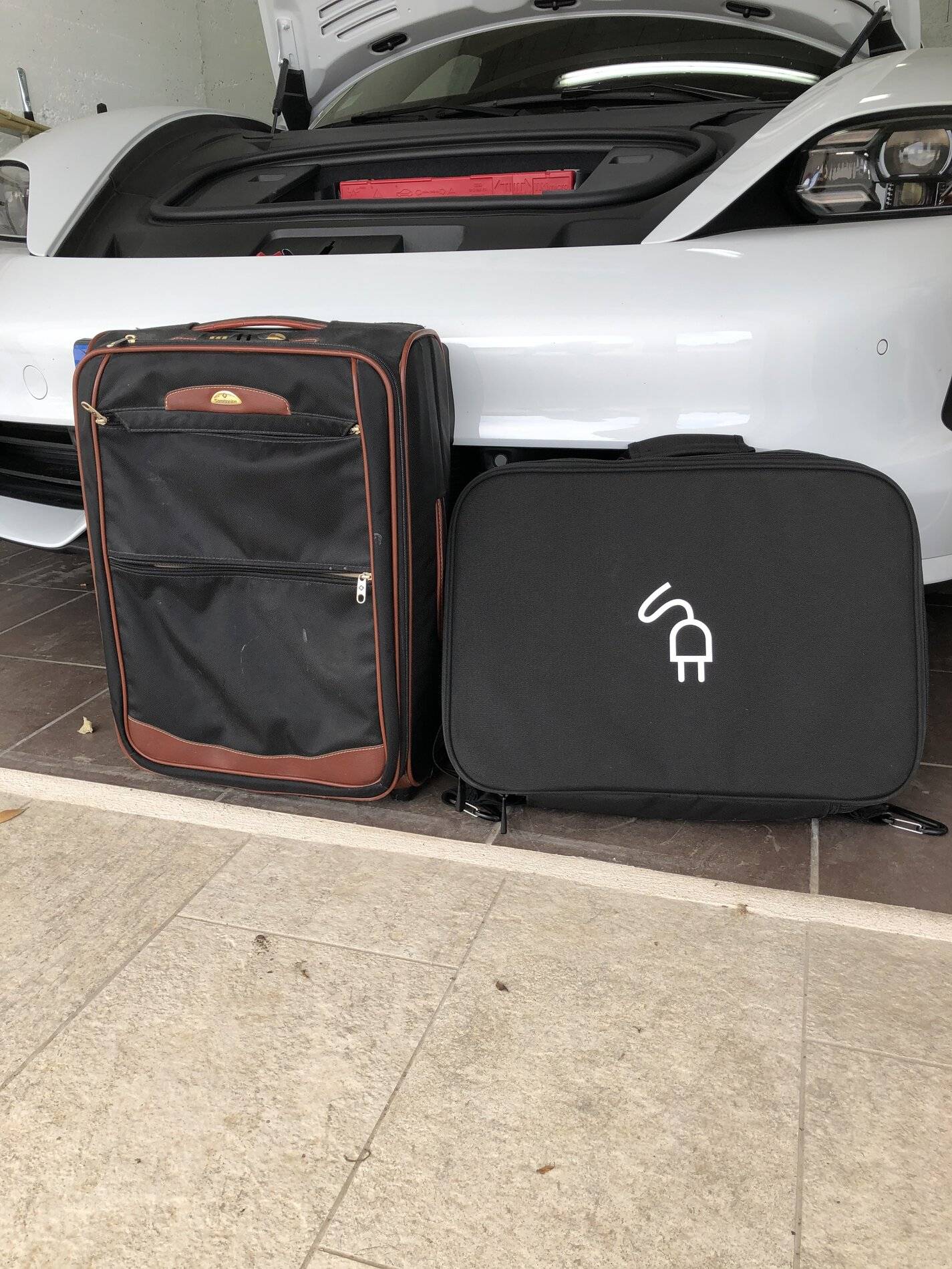 Porsche Taycan Can you fit 2 large check in luggage bags in the trunk? 8B6F18F8-AB4C-473D-A9C7-ECC8E7B020A4