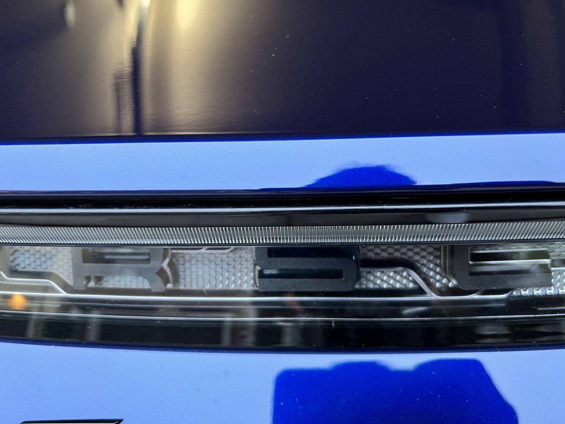 Porsche Taycan 8SP Light Strip with Porsche Logo in Black E6419677-54CF-4911-BD02-5D8D25541ACF