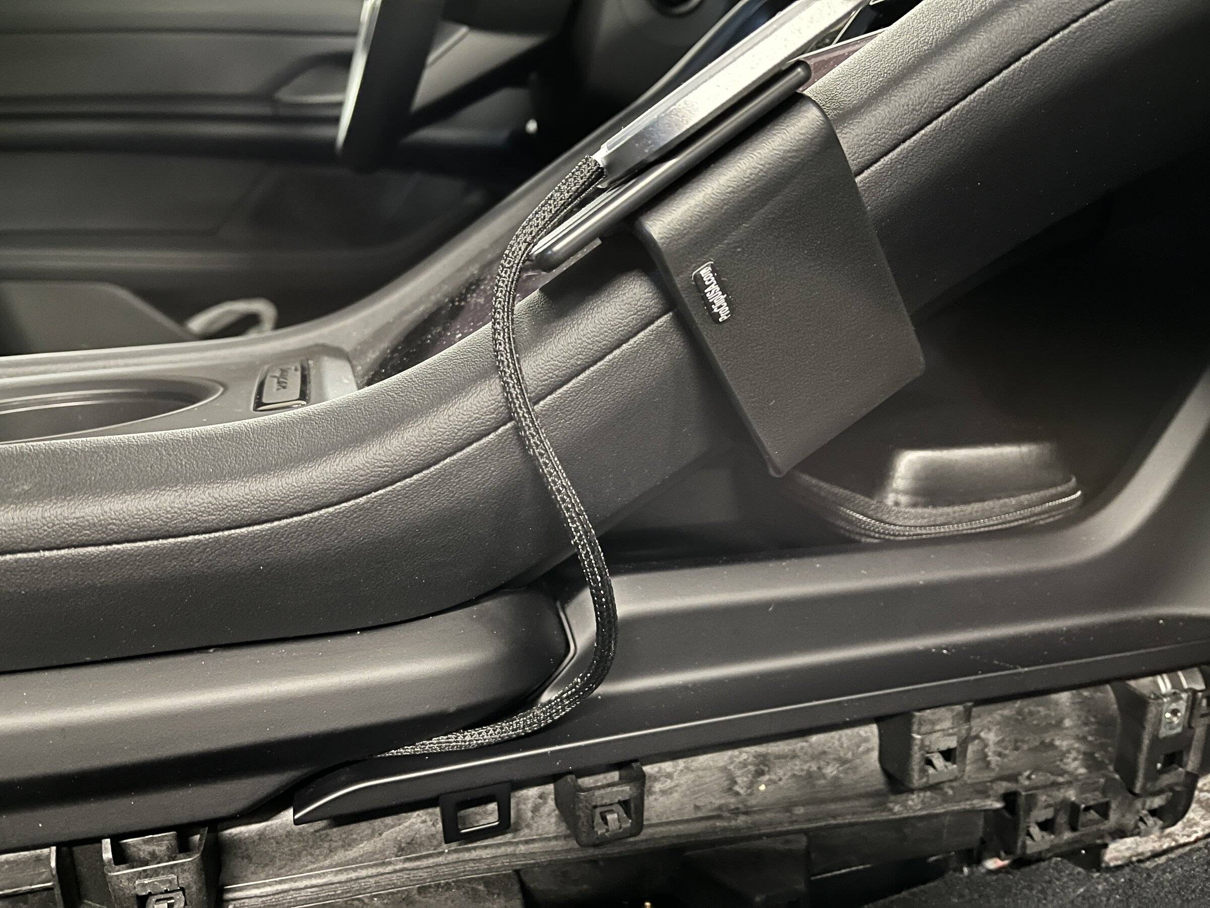 Porsche Taycan Routing Magsafe cable from passenger side of console to USB C port SleevingInstalled.JPG