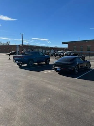 Porsche Taycan Way off topic:   when my Taycan met Rivian IMG_1759.HEIC