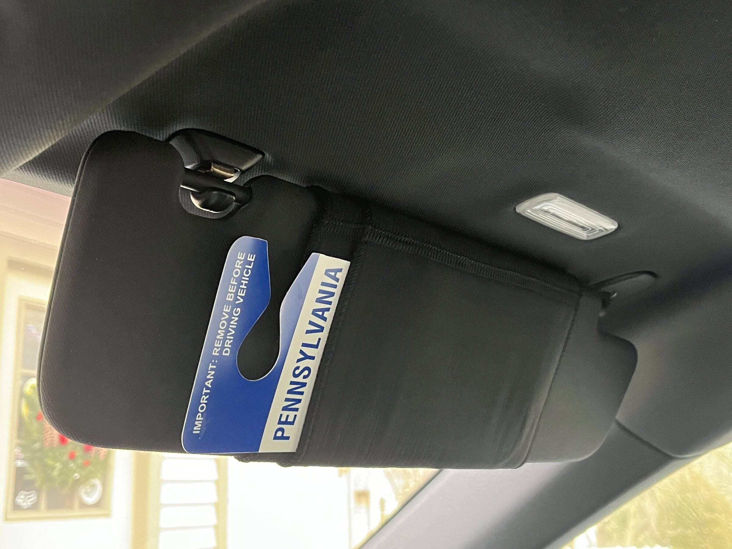 Porsche Taycan Making CT cabin storage user friendly VisorSleeveDown.JPG