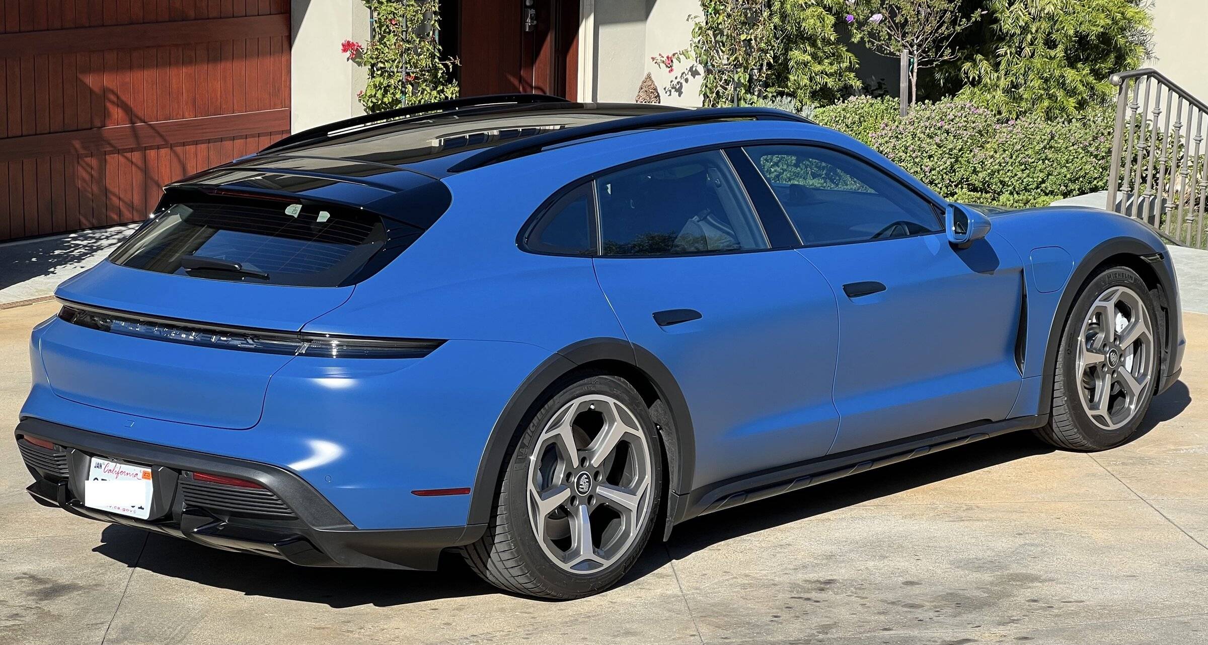 Porsche Taycan Taycan Turbo Cross Turismo CT in Neptune Blue with Satin PPF Film rear_quarter_sun