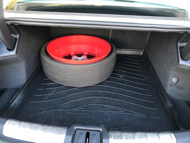 Taycan spare in trunk.JPG