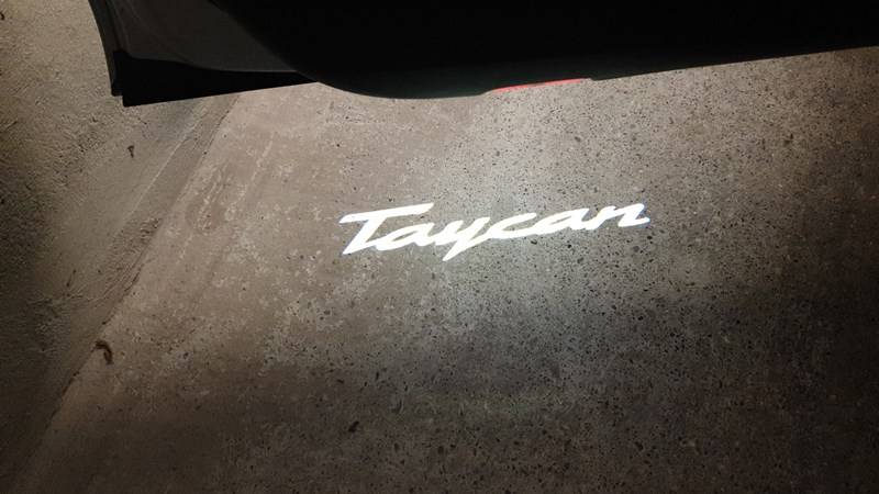 Porsche Taycan Installed puddle lights “Taycan” after