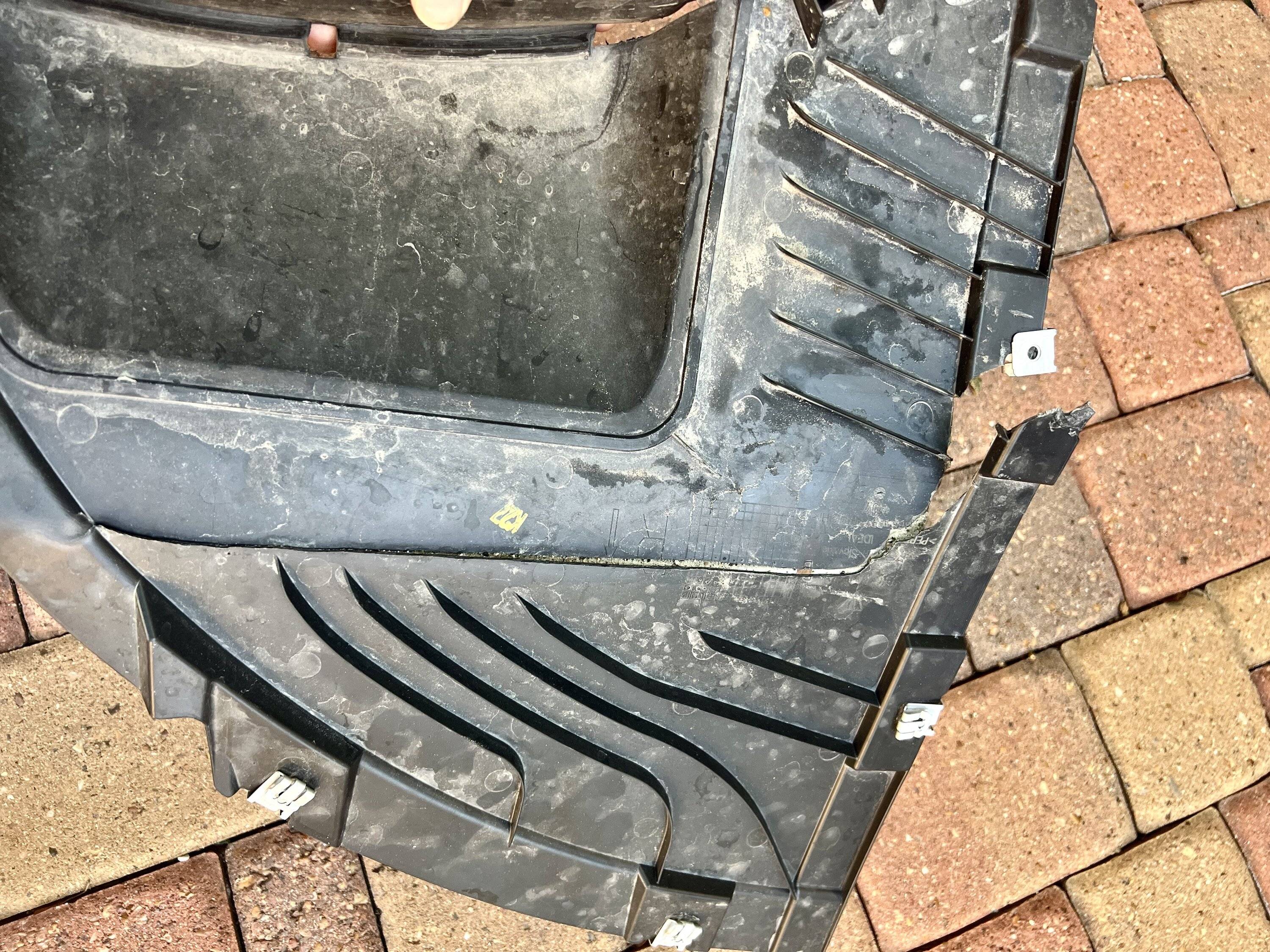 Porsche Taycan Replaced road damaged plastic on underside of CT IMG_6826