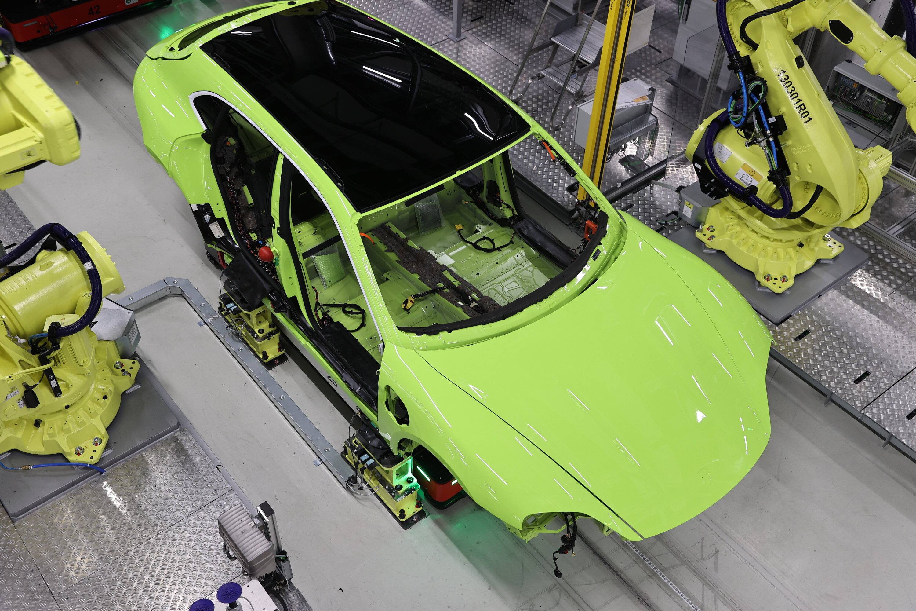 Porsche Taycan Noddy's new PTS Acid Green Cross Turismo Taycan in production! 634ee9b92c989b3e0ae6a50f