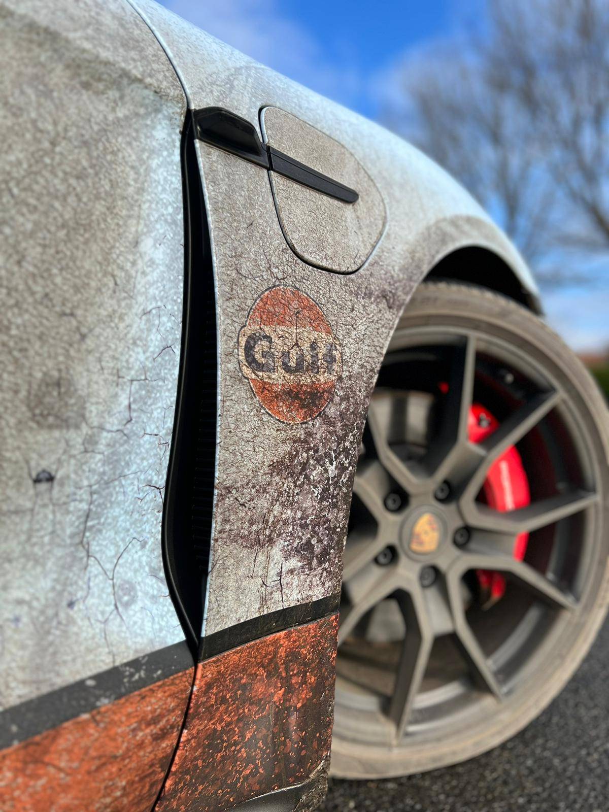 Porsche Taycan Ironic distressed wrap GTS Sports Turismo. Dirty! 50E42351-47F0-4A8C-AED3-837224A615D1