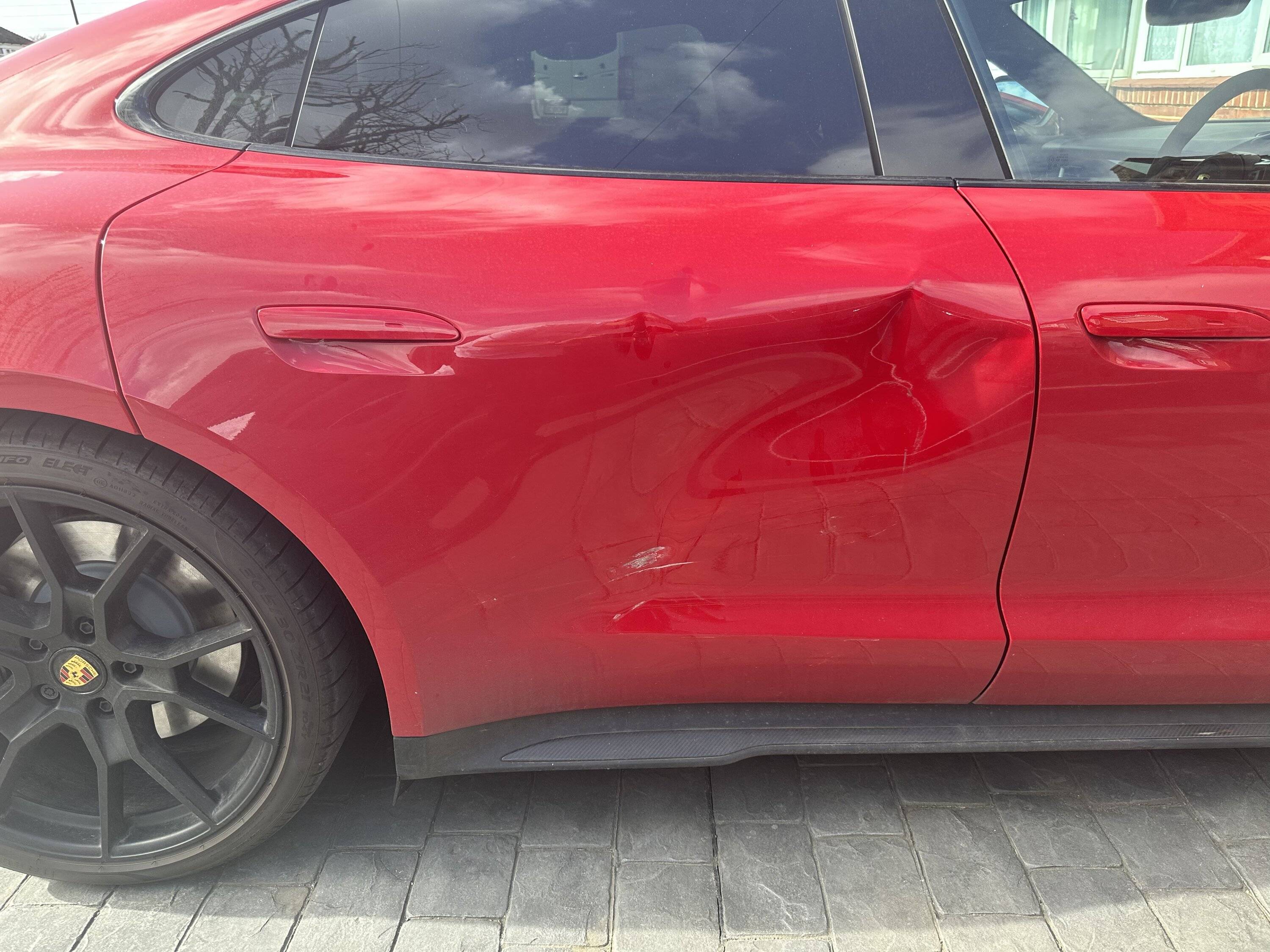 Porsche Taycan Damaged rear door 34C0E430-DA4C-48CC-B612-56A6E8F5BF77