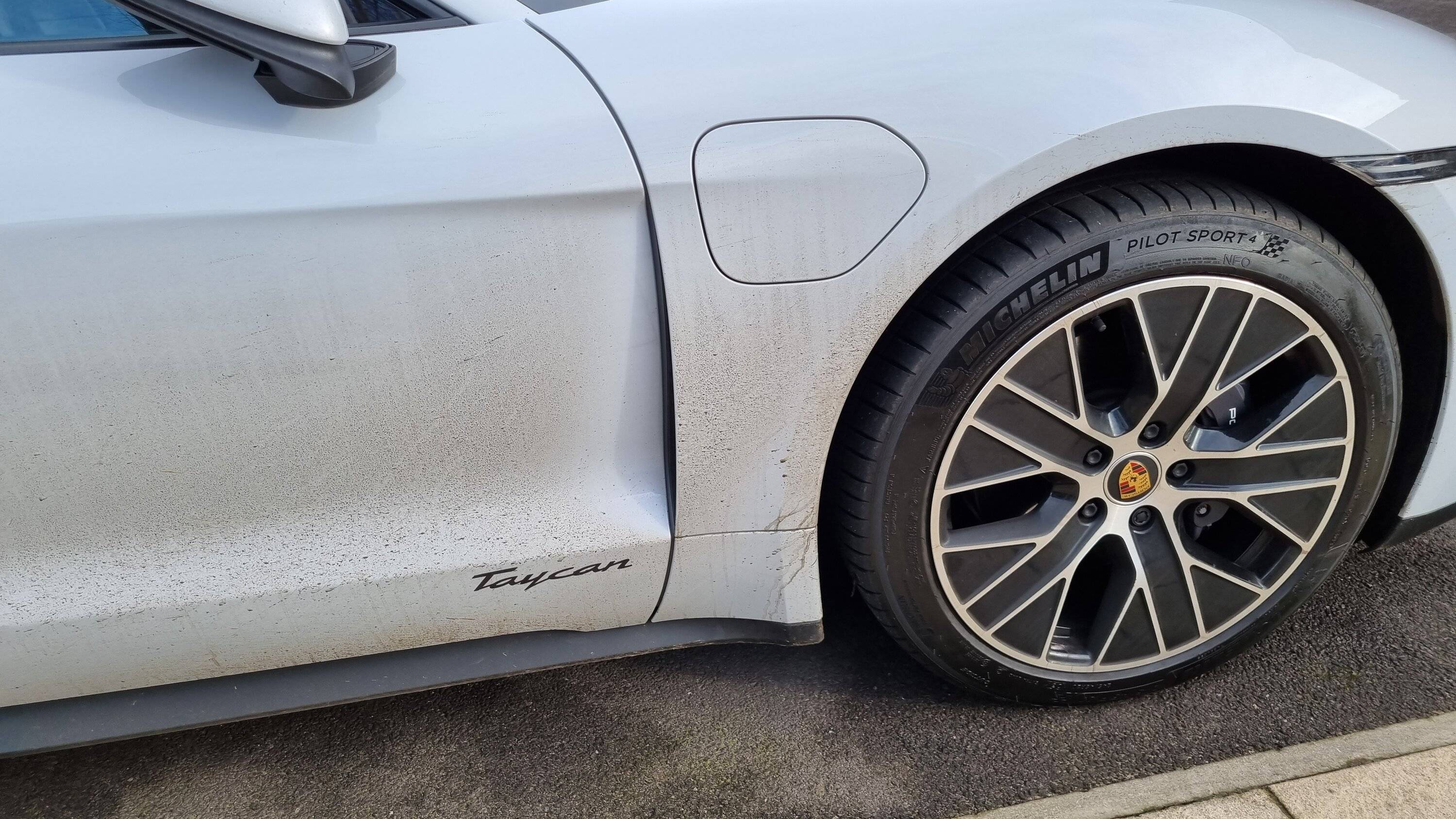 Porsche Taycan Dreaded stone chip scratch through the front wheel vent 20220202_132036
