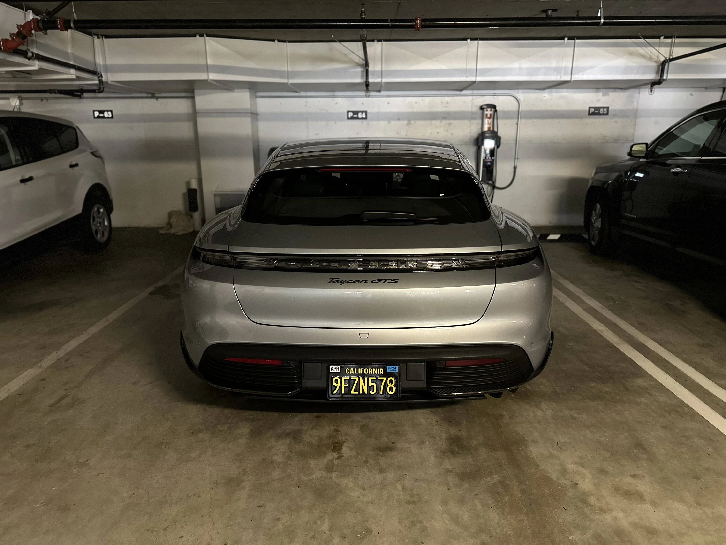 Porsche Taycan Decals on my modded license plate area IMG_0828