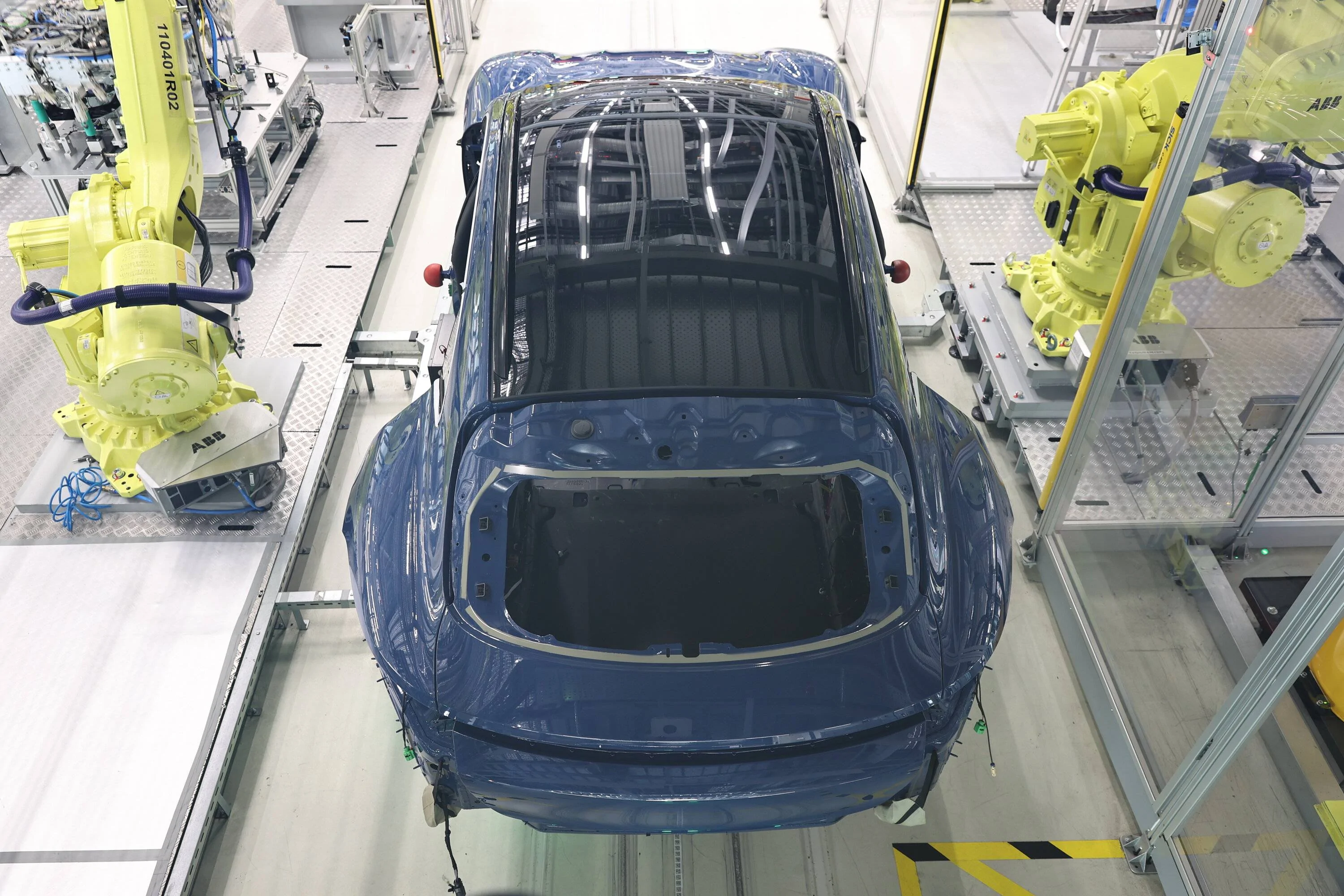 Porsche Taycan July 2023 Deliveries Taycan_4S_Cross_Turismo_Taycan_assembly_installation_read_windo