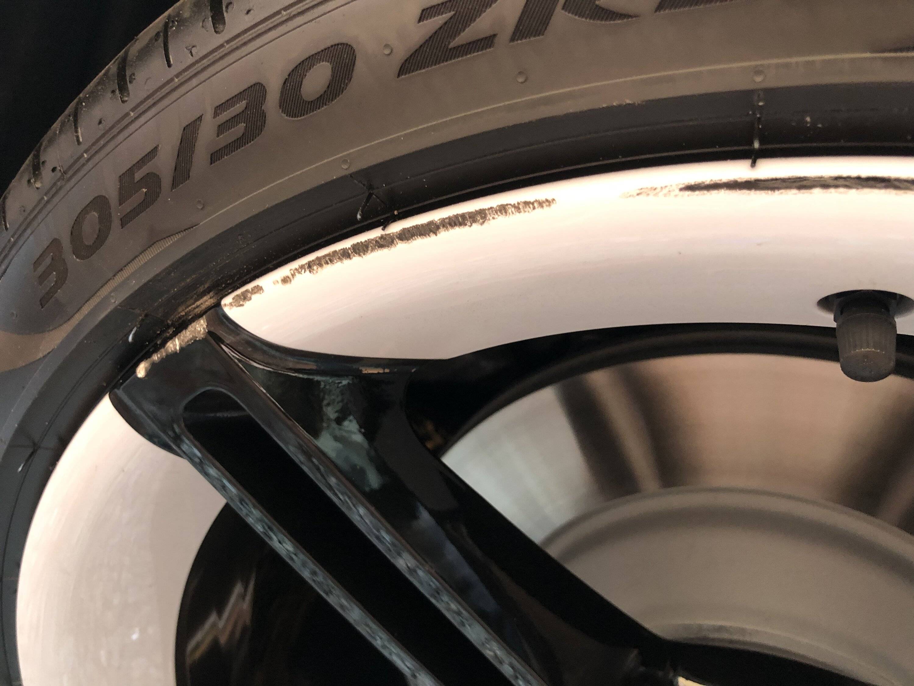 Porsche Taycan Curbed Mission E wheel 88C6F223-EFC1-4ECF-9A8B-2D7825E2D8EC