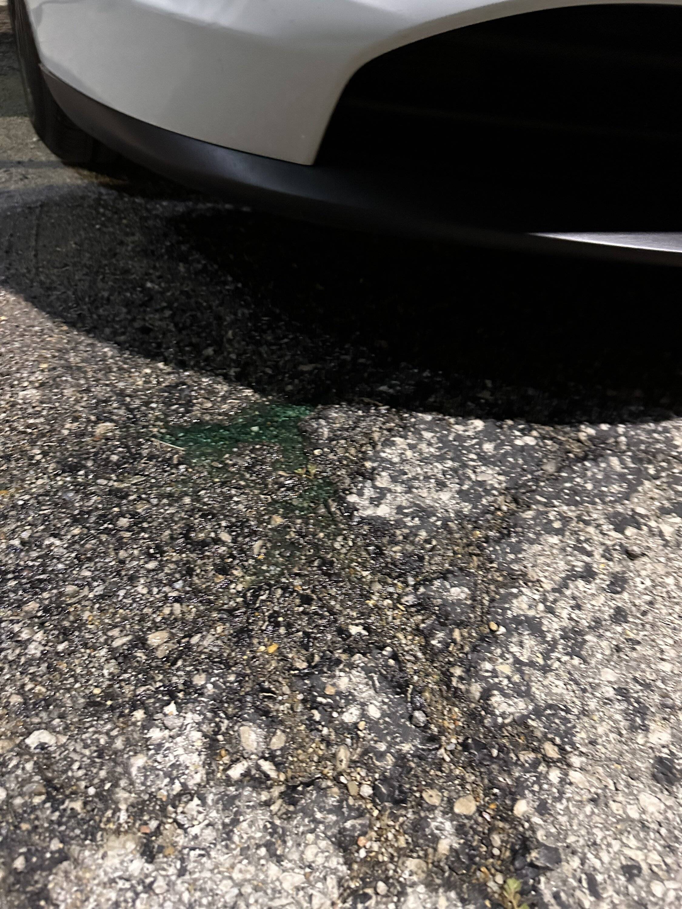 Porsche Taycan Bottomed out on parking lot dip and raised humps. Windshield wiper reservoir damaged IMG_0002