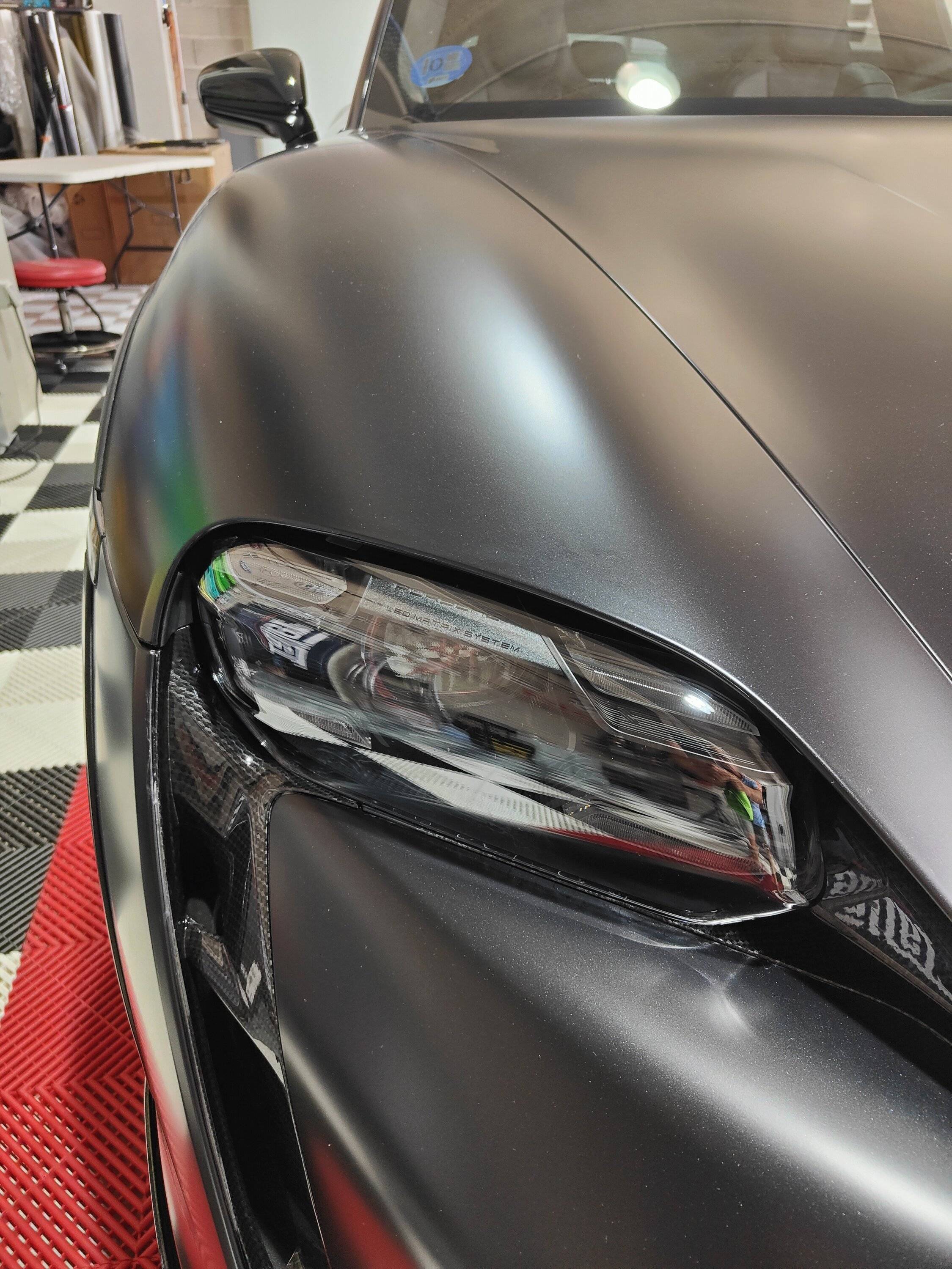 Porsche Taycan MY23 CT4S in satin and carbon fiber, need help with rim protector and ideas for garage floor IMG20230721152149.JPG