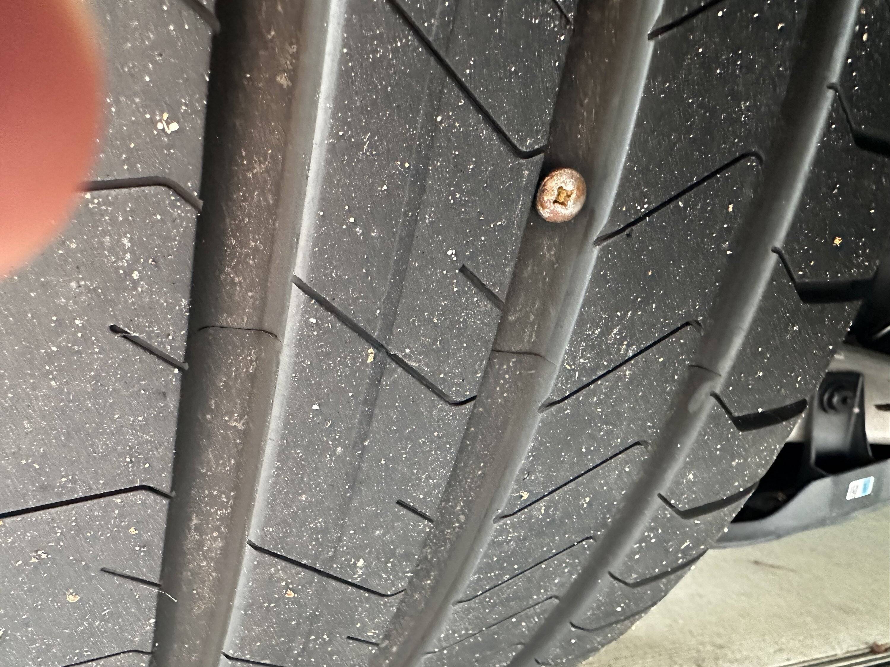 Porsche Taycan Leaking left rear tire IMG_2864