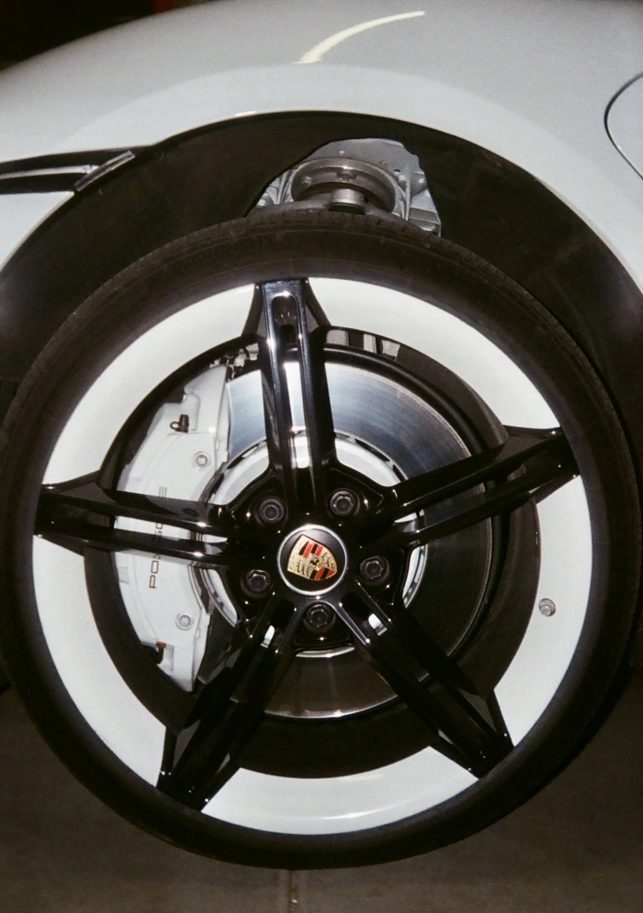 Porsche Taycan PSCB Brake Calipers Painted Black or Yellow on Mission E Wheels White Calipers on Film