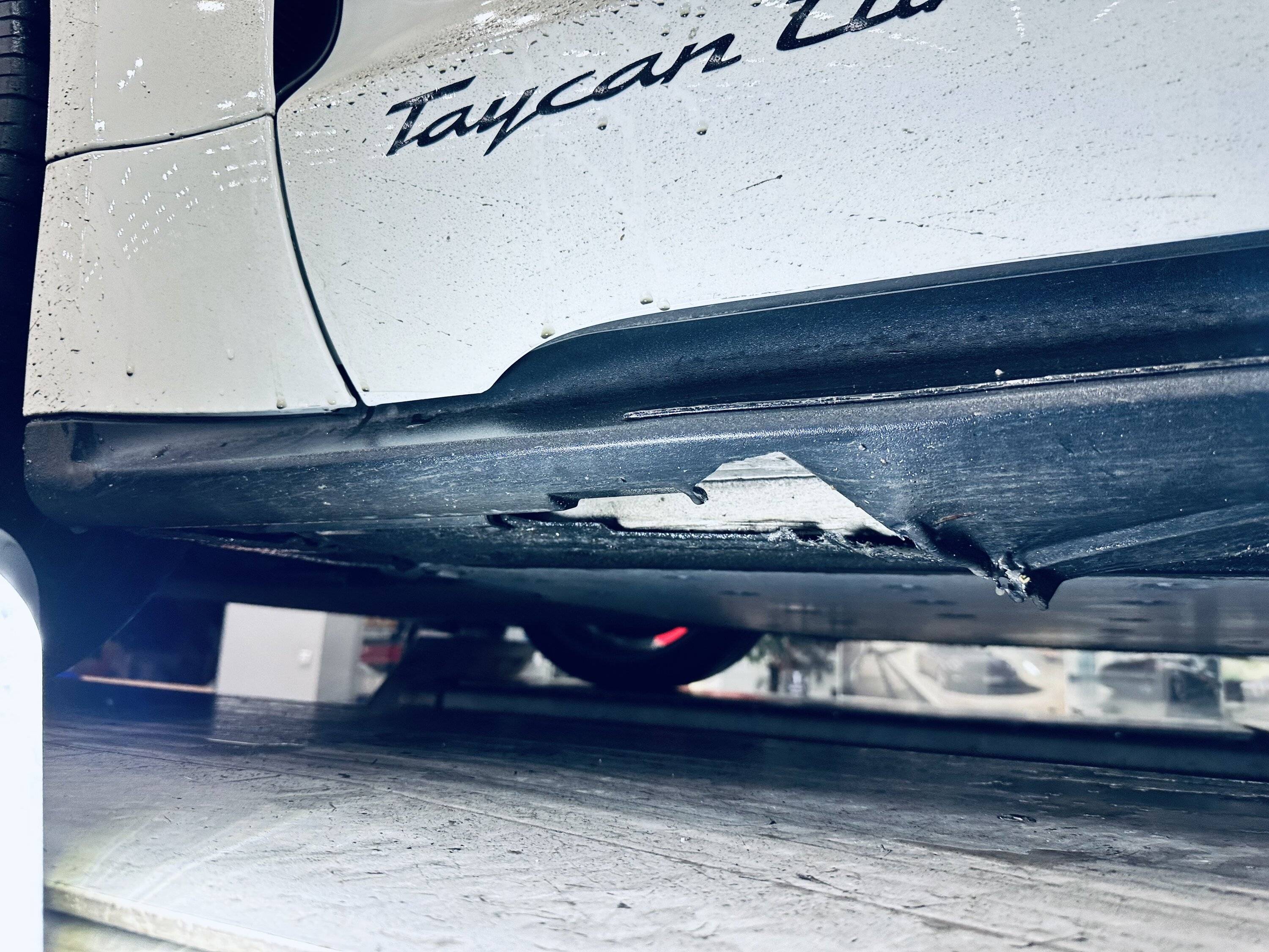 Porsche Taycan Bottomed out in parking lots - damaged side skirts and jack stand bracket (repair info inside) IMG_5036