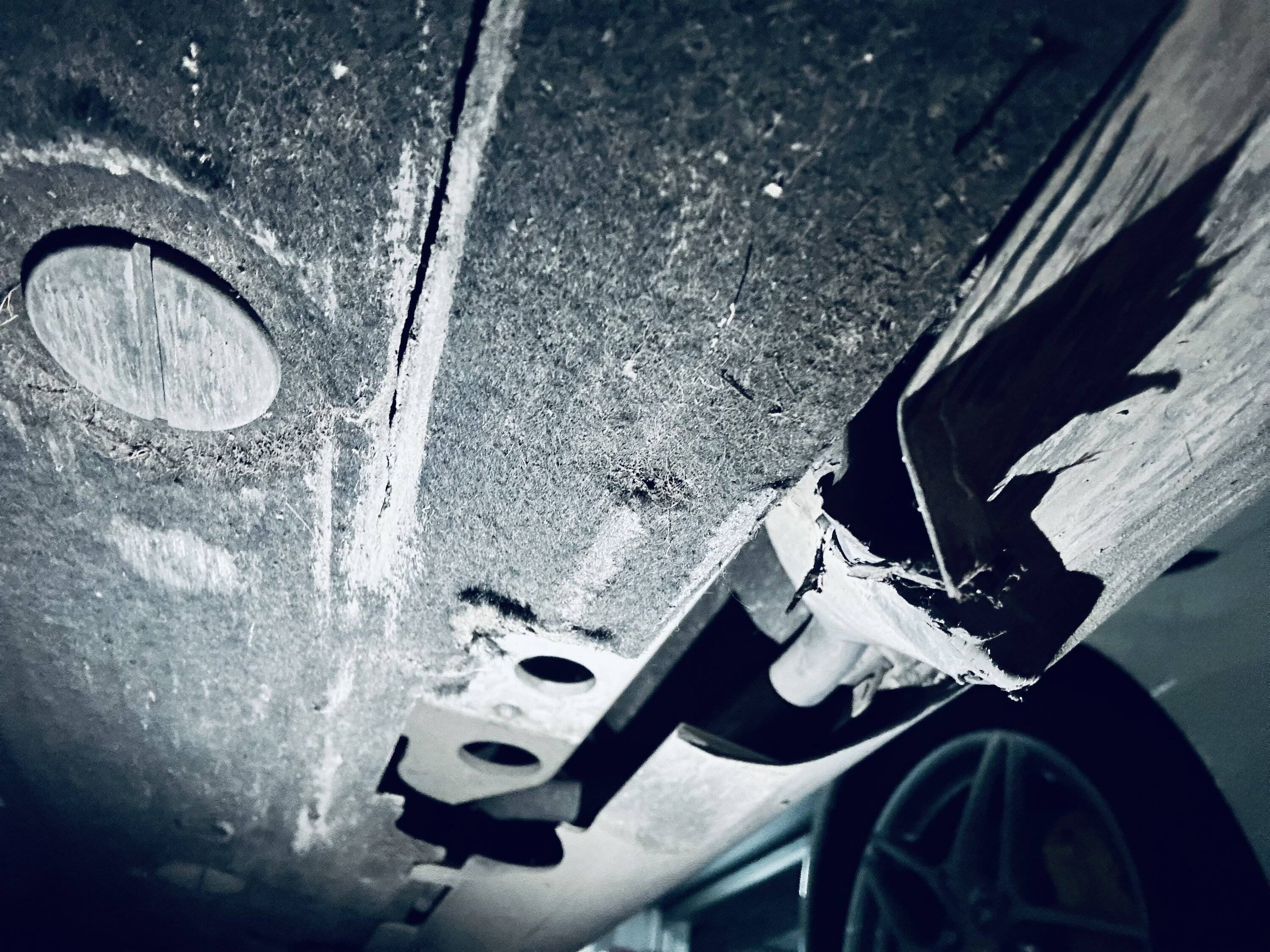 Porsche Taycan Bottomed out in parking lots - damaged side skirts and jack stand bracket (repair info inside) IMG_5030