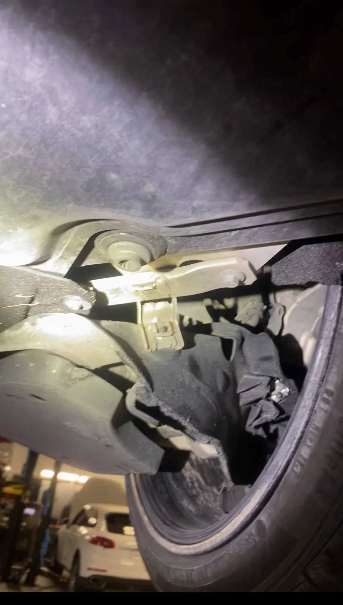 Porsche Taycan Bottomed out in parking lots - damaged side skirts and jack stand bracket (repair info inside) IMG_2362