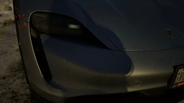 Porsche Taycan One headlight stays on - what does this indicate? IMG_1163