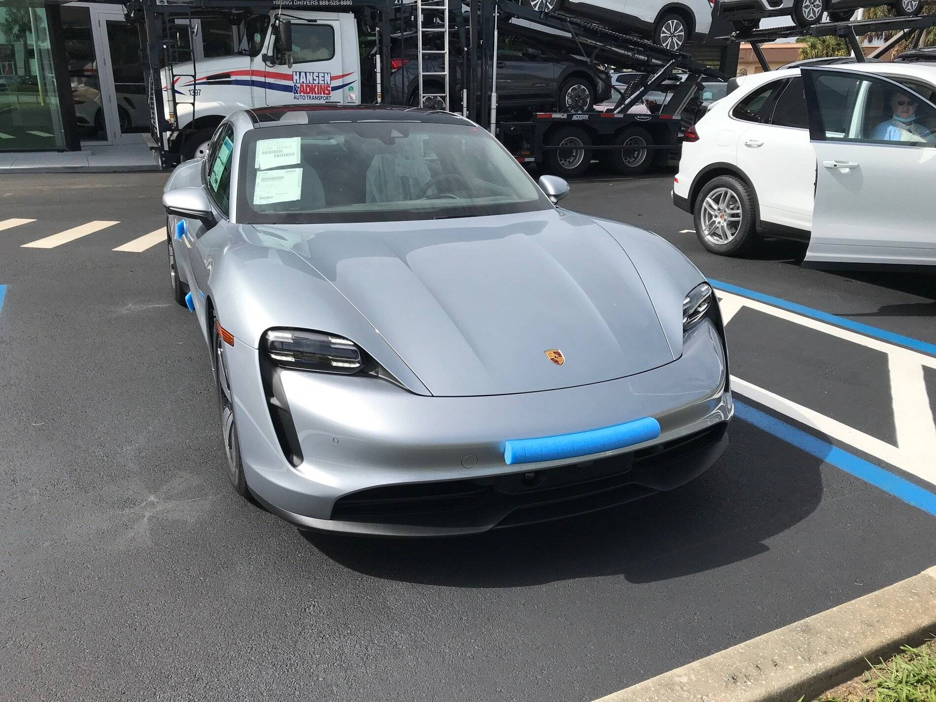 Porsche Taycan DOLOMITE SILVER Taycan Club our taycan at dealership front view bad headlight still.JPG