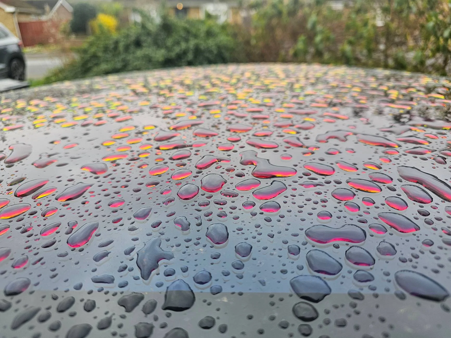 Porsche Taycan Weird coloured water droplets 1000076488