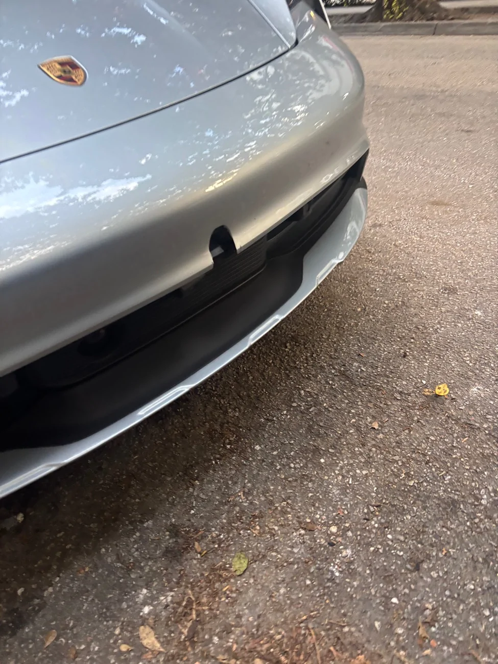 Porsche Taycan Someone hit my car and ran. Front bumper hole IMG_7310
