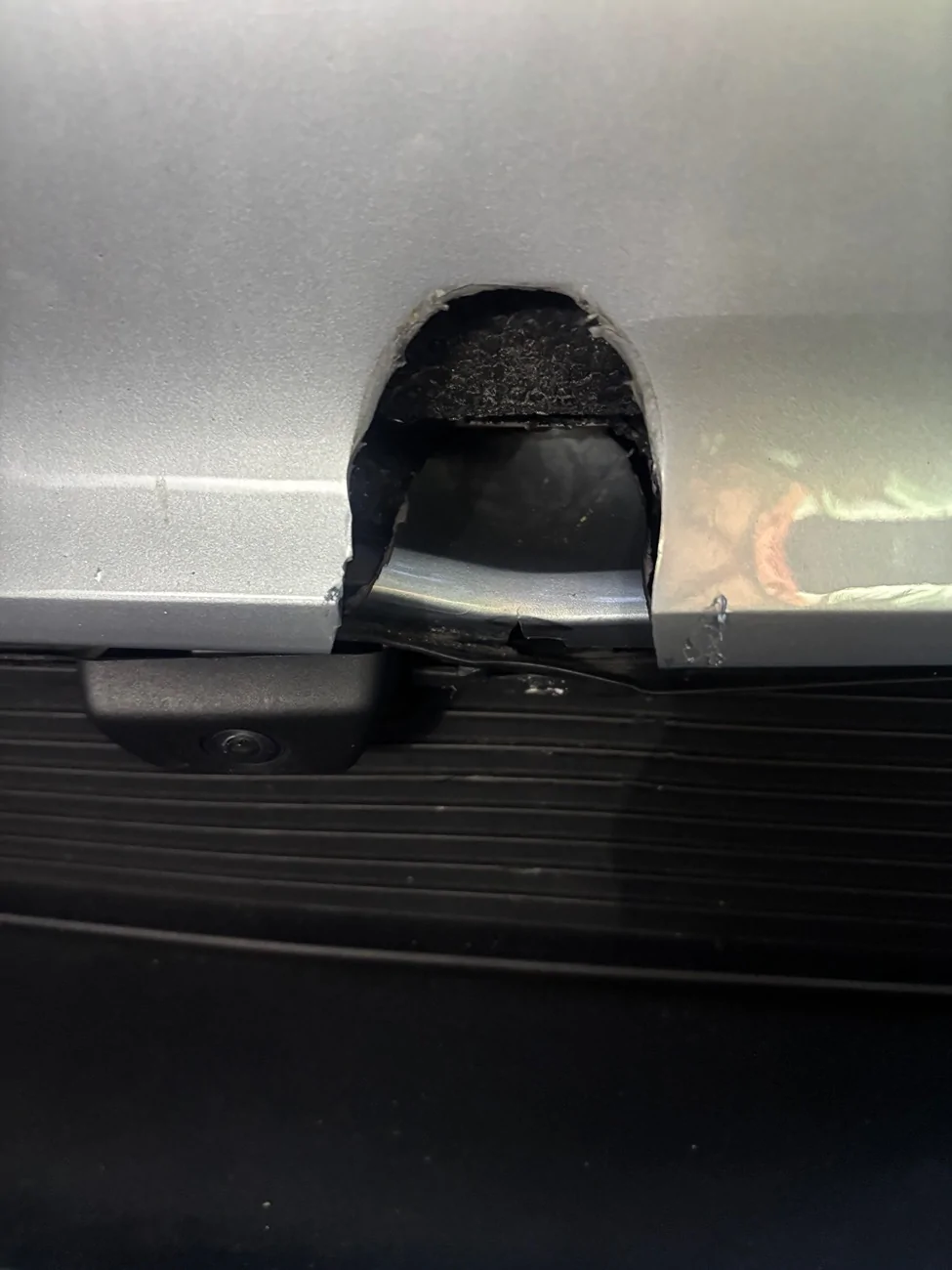 Porsche Taycan Someone hit my car and ran. Front bumper hole IMG_7315