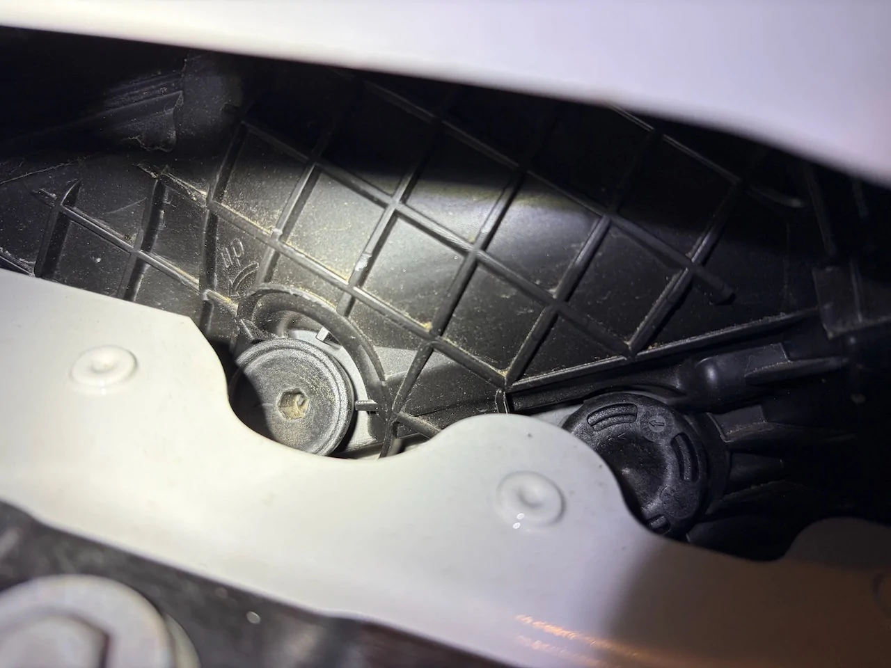 Porsche Taycan DIY headlight up/down adjustment driver-adjustment-clos