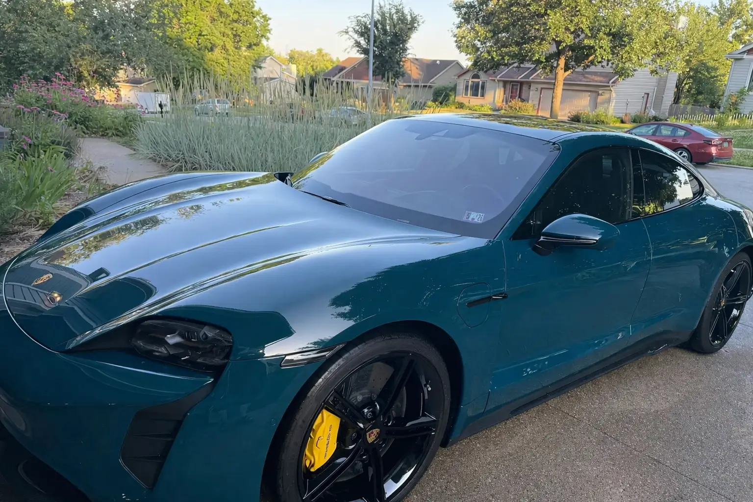 Porsche Taycan Fjord Green Taycan with painted wheels 5090f44a-e9fa-49ab-a505-664d0bf94c83