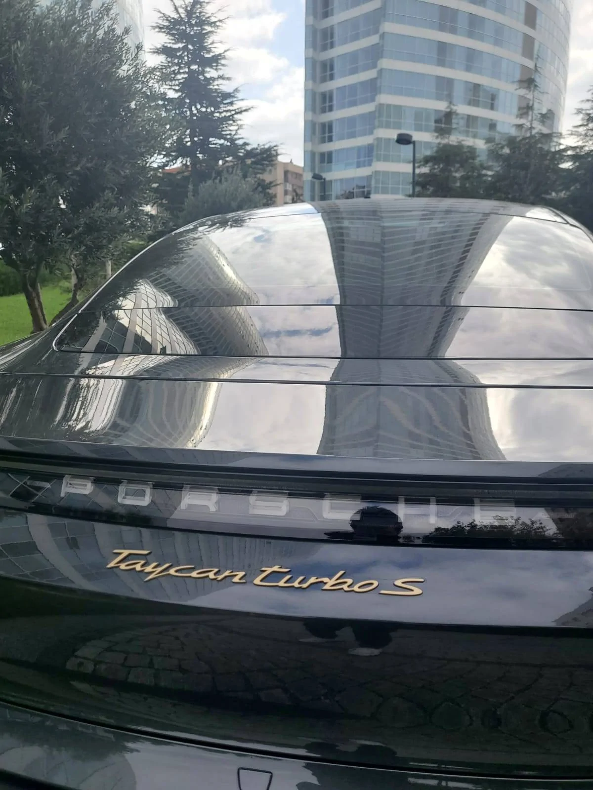 Porsche Taycan Aurum wheels + custom painted Taycan model logo emblem WhatsApp Image 2020-10-22 at 14.47.03