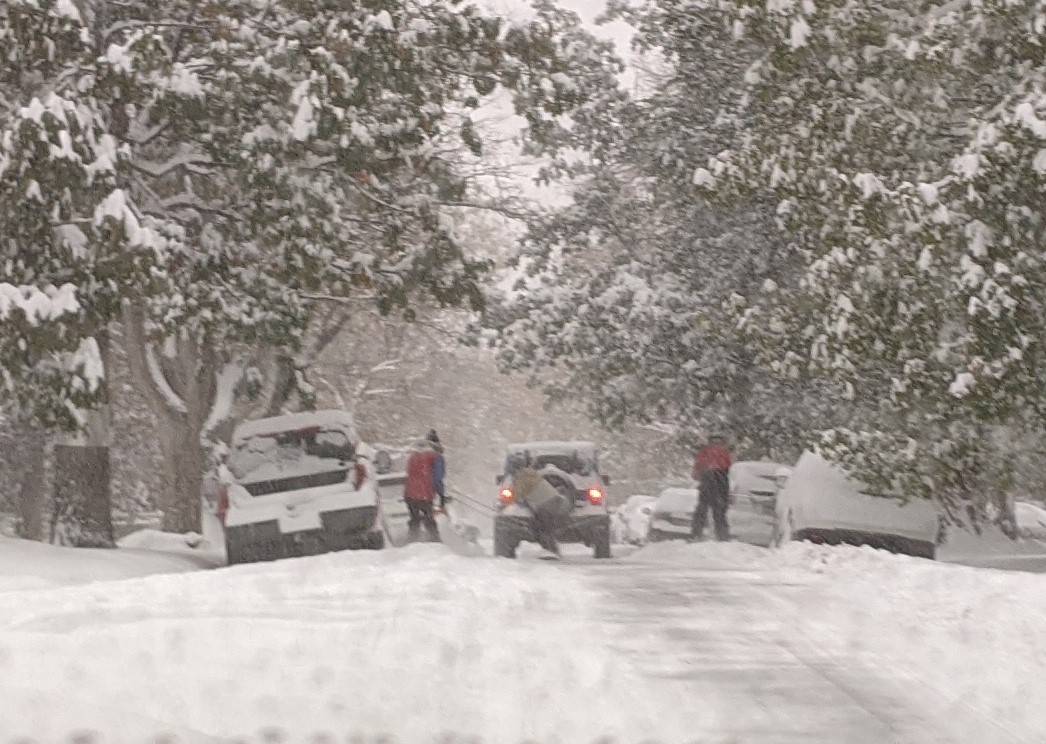Porsche Taycan Winter Driving First Impressions snowboarders on the street