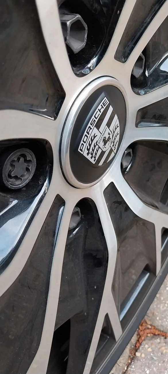 Porsche Taycan Centre cap not in all the way 20260515_200125