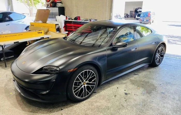XPEL Stealth PPF installed on gloss black Taycan