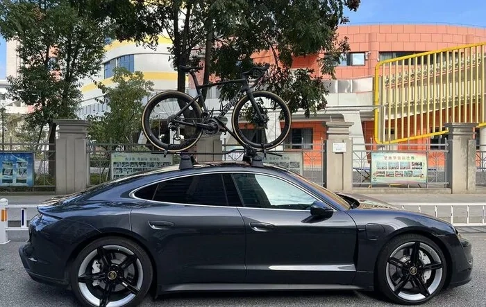 Roof Rack with Thule Bike Rack and Vector installed on Taycan sedan