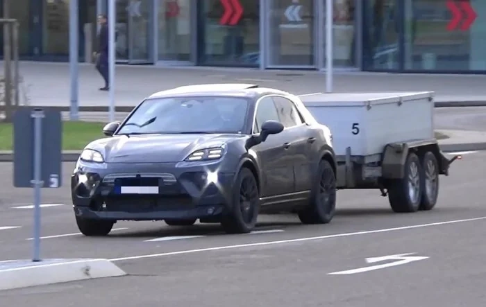 Macan EV spied towing trailer, nice to see